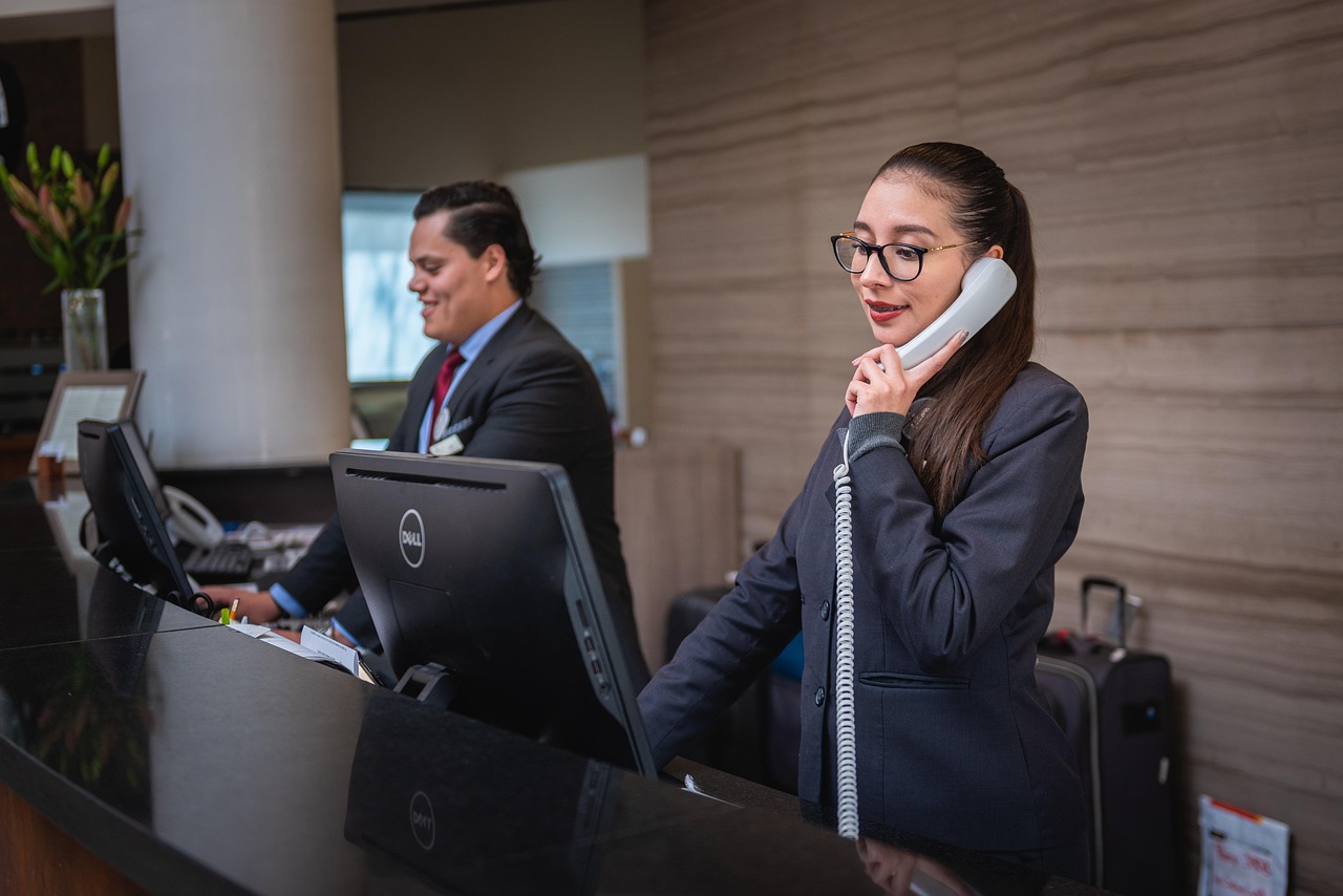 Services Areas 2 receptionists, phone call, hotel, reception, woman, man, work, attention, lobby, employees, professional, company, assistance, hotel, hotel, hotel, hotel, hotel, reception